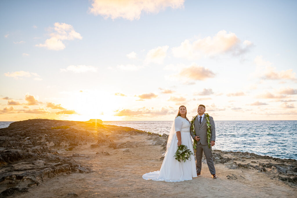 Couple at sunrise with bouquet