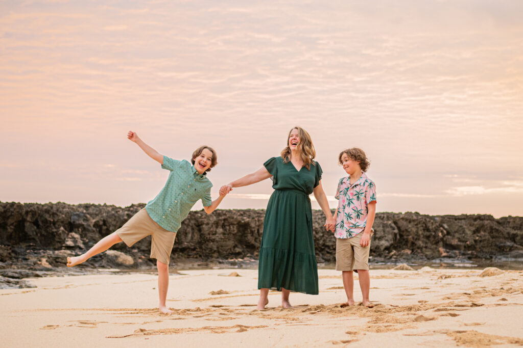 Mom and kids on the beach at sunset during their Hawaii Vacation photoshoot